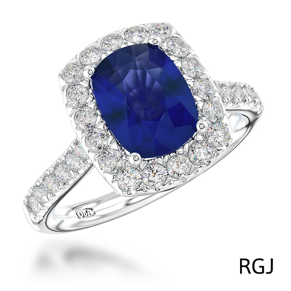 The Evie Platinum 2.11ct Cushion Cut Blue Sapphire Ring With 0.57ct Diamond Halo And Diamond Set Shoulders