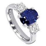 The Larkspur Platinum 2.14ct Oval Sapphire and 0.80ct Diamond Three Stone Engagement Ring