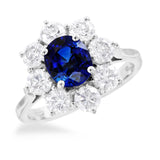 18ct White Gold 1.70ct Oval Cut Blue Sapphire And 1.65ct Round Brilliant Cut Diamond Halo Cluster Ring