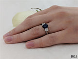 The Royal Platinum 1.48ct Oval Cut Blue Sapphire And 0.58ct Round Brilliant Cut Diamond Three Stone Ring