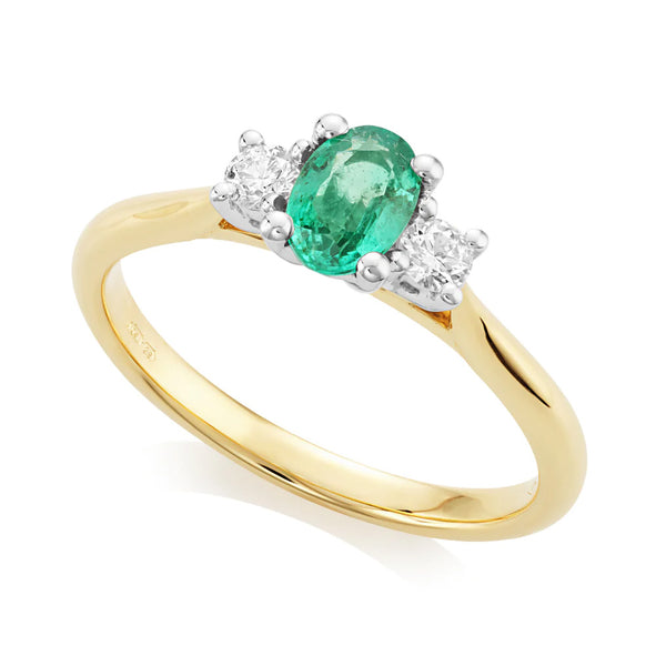 18ct Yellow And White Gold 0.45ct Oval Cut Emerald And 0.16ct Round Brilliant Cut Diamond Three Stone Ring