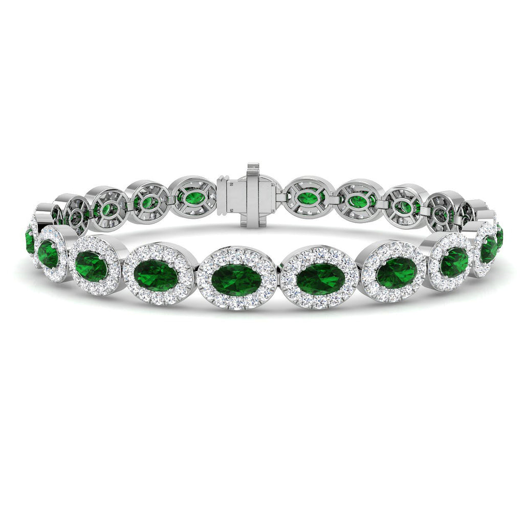 18ct White Gold 4.54ct Oval Cut Emerald And 3.41ct Diamond Halo Bracelet