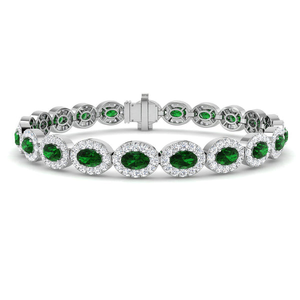 18ct White Gold 4.54ct Oval Cut Emerald And 3.41ct Diamond Halo Bracelet