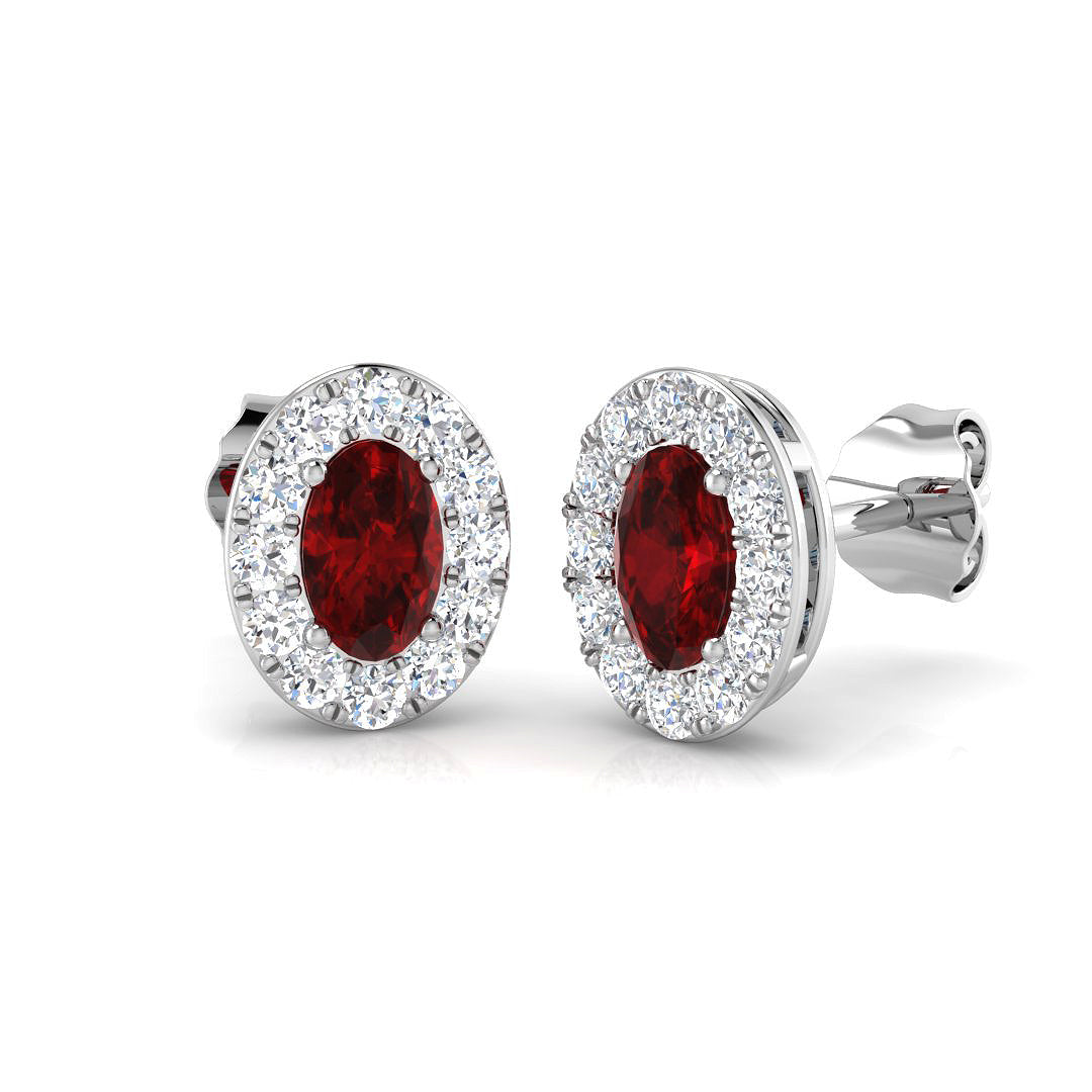 18ct White Gold 0.62ct Oval Cut Ruby And 0.31ct Diamond Halo Stud Earrings