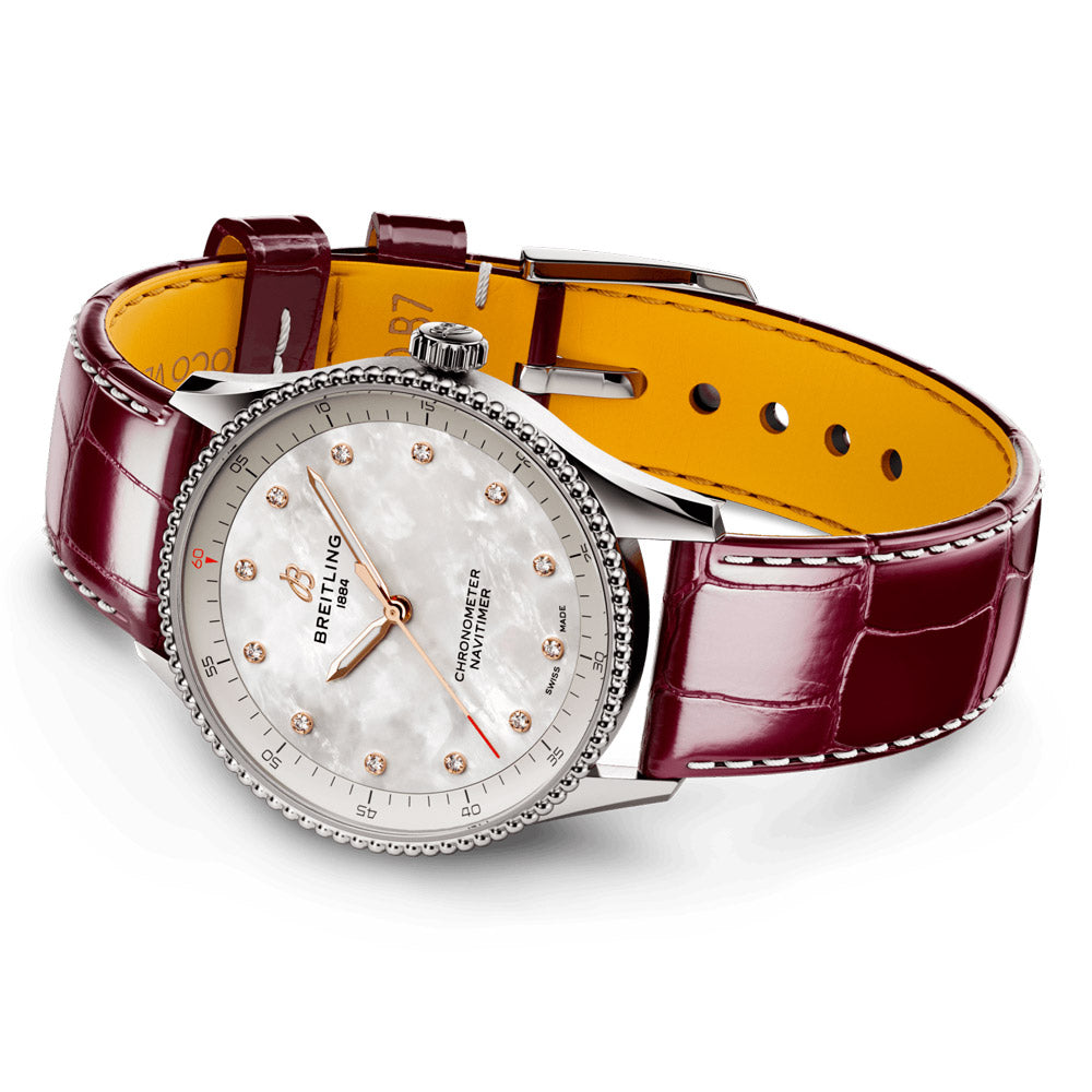 breitling navitimer 32mm mother of pearl diamond dot dial stainless steel quartz ladies watch laying down image
