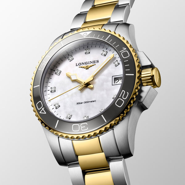 longines hydroconquest 32mm mother of pearl diamond dot dial yellow pvd steel bi colour quartz ladies watch front side facing image