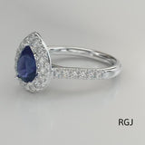 The Evie Platinum 0.77ct Pear Cut Blue Sapphire Ring With 0.44ct Diamond Halo And Diamond Set Shoulders