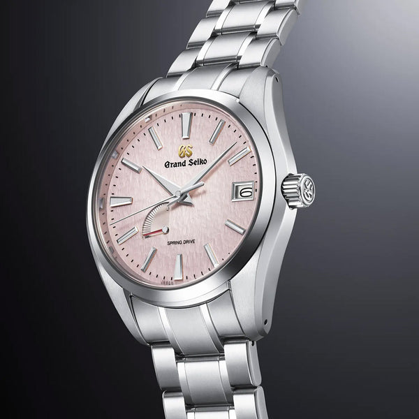 grand seiko pink snowflake spring drive 20th anniversary limited edition 41mm pink dial steel on steel bracelet automatic watch front side facing upright image