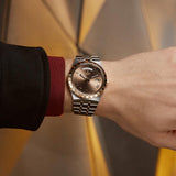 tudor royal 41mm chocolate brown dial gold and steel on gold and steel bracelet automatic watch lifestyle image