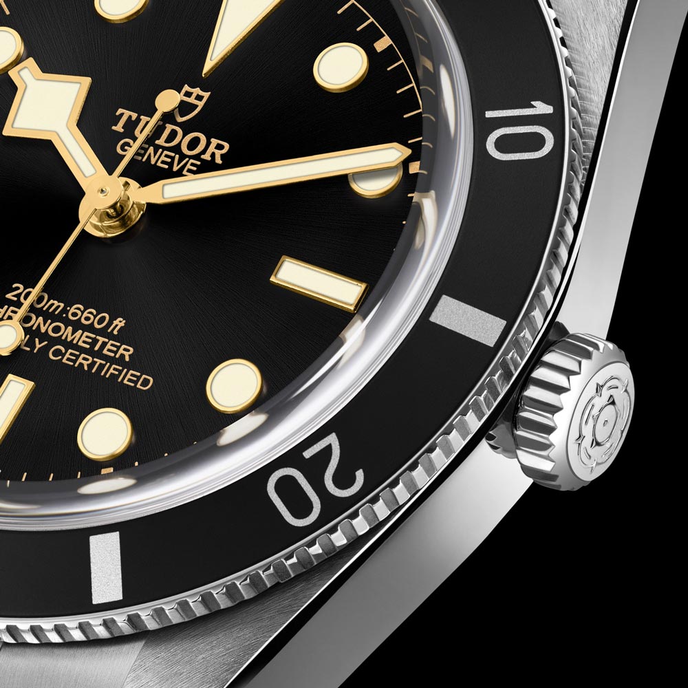 tudor black bay 54 37mm black dial steel on steel bracelet automatic watch bezel closeup