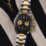 tudor black bay chrono s&g 41mm black dial gold and steel on steel and gold bracelet automatic chronograph watch lifestyle image