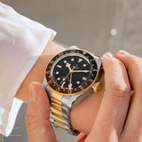 tudor black bay gmt s&g 41mm black dial gold and steel on gold and steel bracelet automatic watch lifestyle image