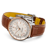 breitling navitimer 41mm cream dial rose gold bezel and steel on leather strap automatic gents watch laying down image