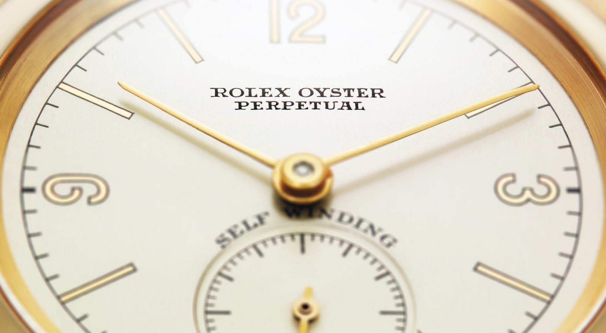 partial closeup of Rolex oyster perpetual dial landscape banner image