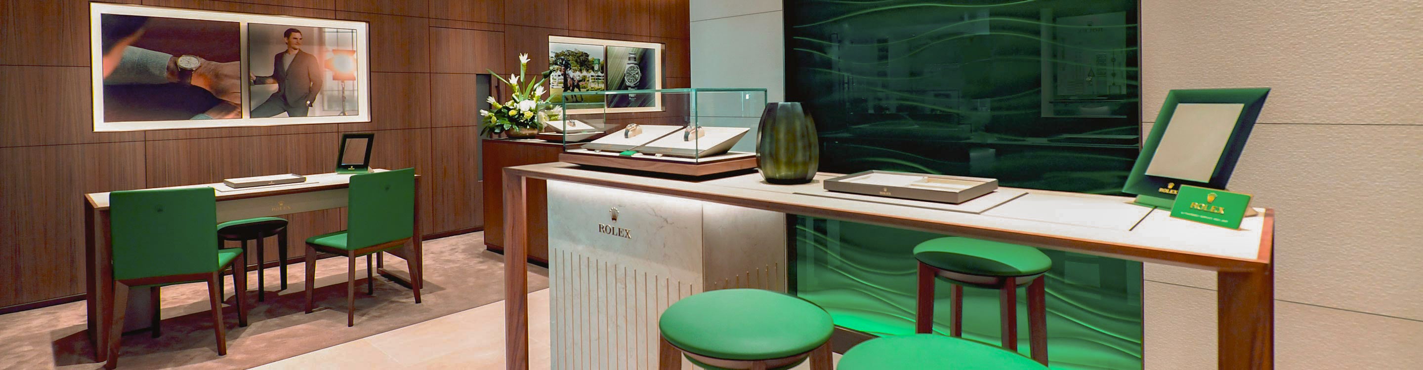 rolex at robert gatward our showrooms, Modern office interior with green chairs and a white desk cover image for desktop