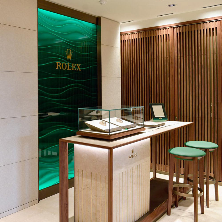 rolex at robert gatward our showroom, showing Rolex display case in our Windsor store with green and wooden accents image for mobile