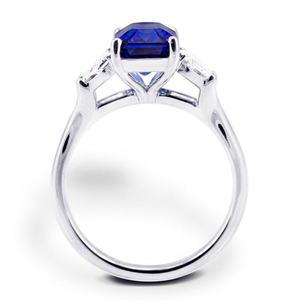 The Florentine Platinum 3.32ct Emerald Cut Blue Sapphire and 0.63ct Diamond Three Stone Engagement Ring