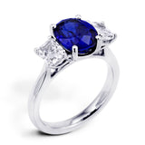 Platinum 3.16ct Oval Cut Sapphire And 1.06ct Radiant Cut Diamond Three Stone Ring