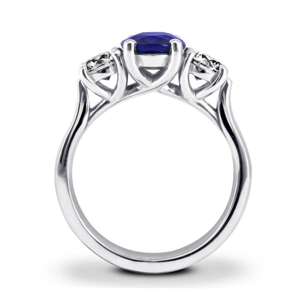 The Larkspur Platinum 2.14ct Oval Sapphire and 0.80ct Diamond Three Stone Engagement Ring