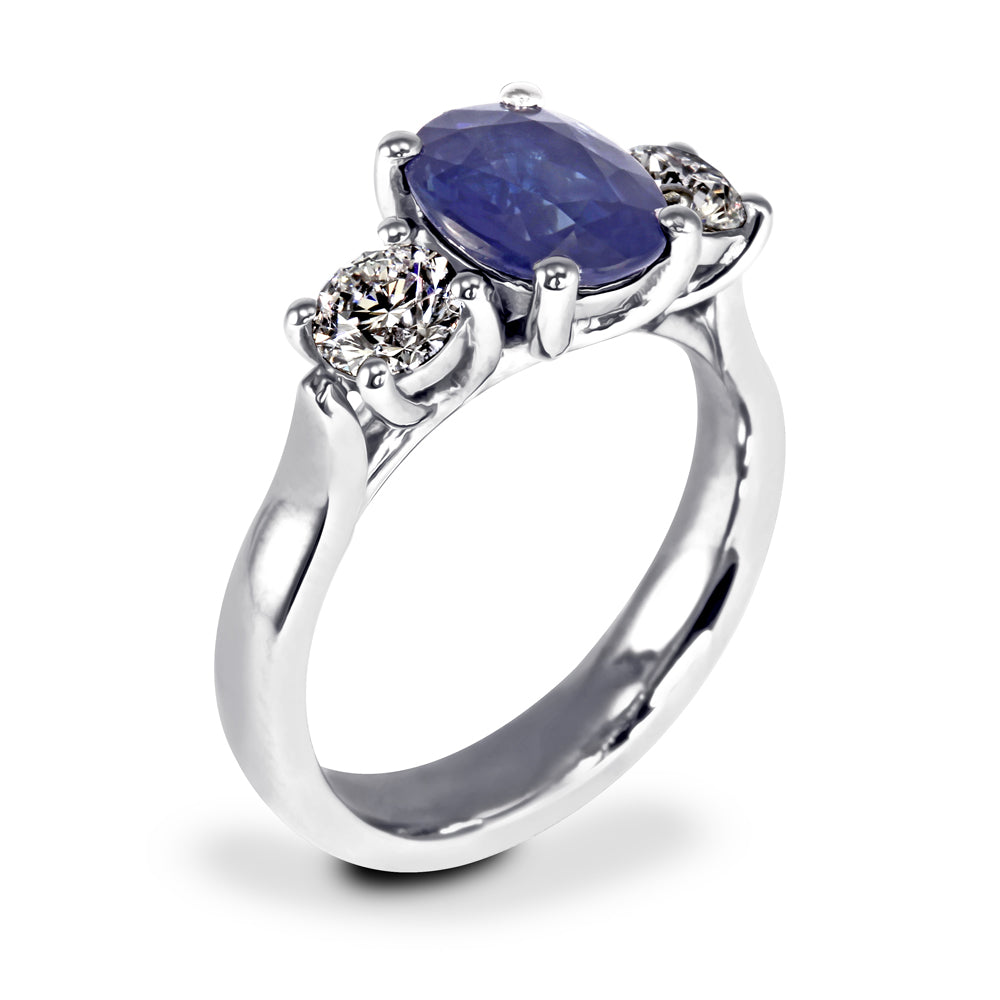 The Larkspur Platinum 2.14ct Oval Sapphire and 0.80ct Diamond Three Stone Engagement Ring