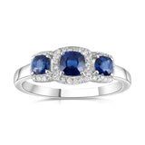 18ct white gold 0.75ct cushion cut blue sapphire three stone ring with 0.11ct diamond halo setting view