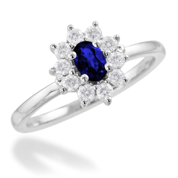 18ct White Gold 0.35ct Oval Cut Blue Sapphire And 0.27ct Round Brilliant Cut Diamond Halo Cluster Ring