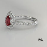 The Skye Platinum 1.92ct Pear Cut Ruby Ring With 0.44ct Diamond Halo And Diamond Set Shoulders