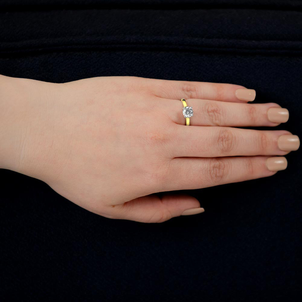 the round brilliant cut four claw 18ct yellow gold and platinum lab grown diamond solitaire engagement ring model shot