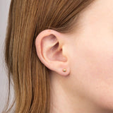 9ct yellow gold textured ball stud earrings model shot