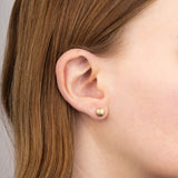 9ct yellow gold textured ball stud earrings model shot