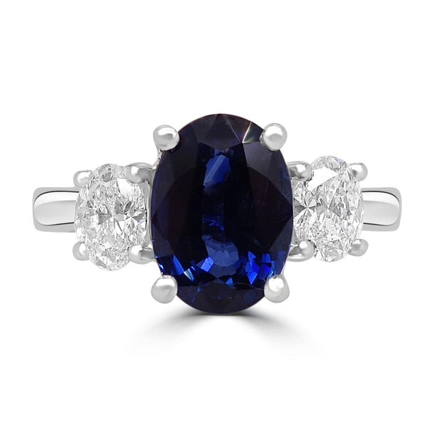 Platinum 2.63ct Oval Cut Sapphire And 0.63ct Diamond Three Stone Engagement Ring