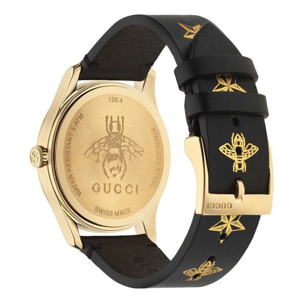 gucci g-timeless 38mm signature black dial gold PVD steel watch on a matching leather strap black side facing upright image
