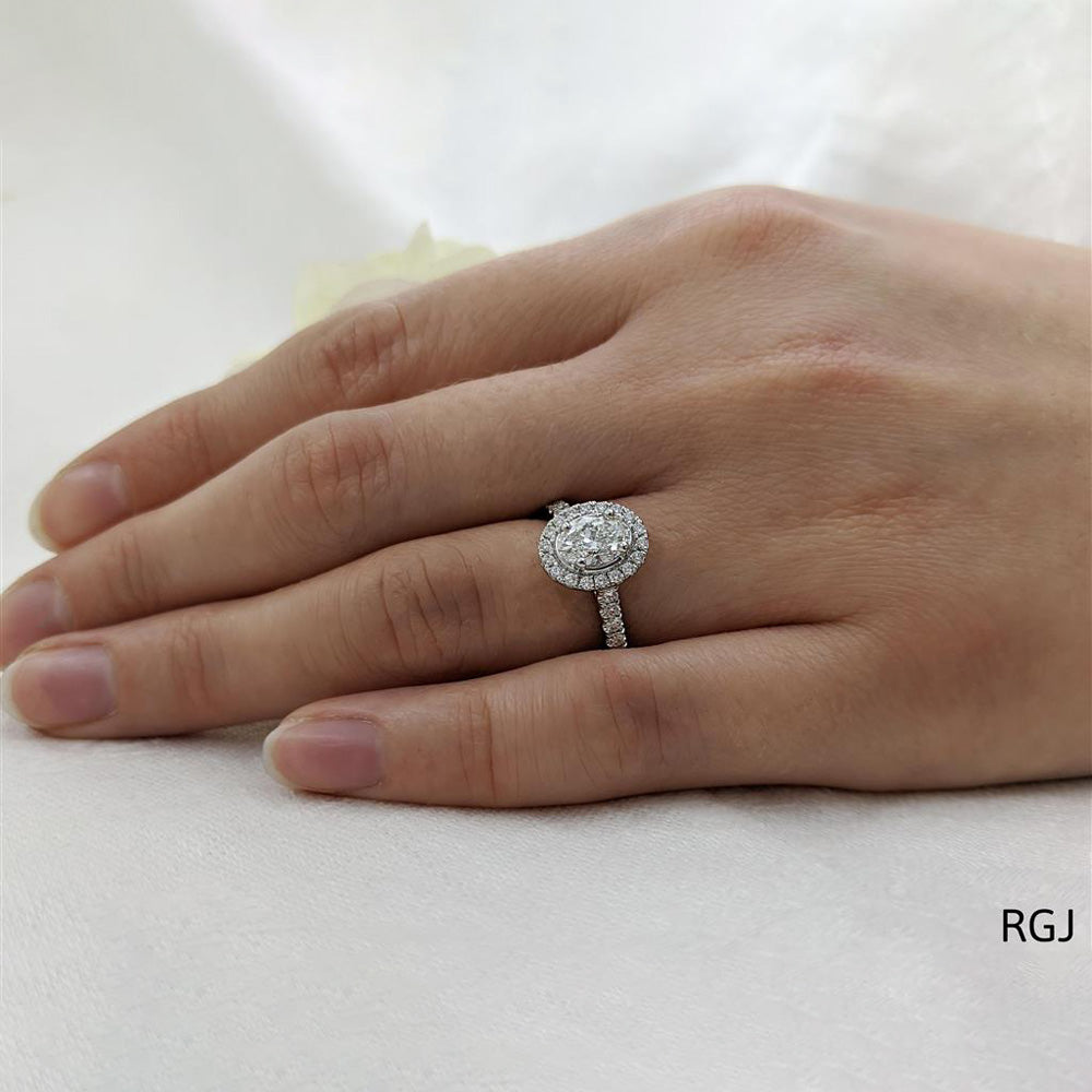 The Skye Platinum 0.72ct Oval Cut Diamond Engagement Ring With 0.35ct Diamond Halo And Diamond Set Shoulders