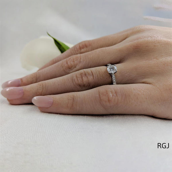 The Memoire Classic Platinum 0.50ct Round Brilliant Cut Diamond Solitaire Engagement Ring With 0.20ct Diamond Set Shoulders