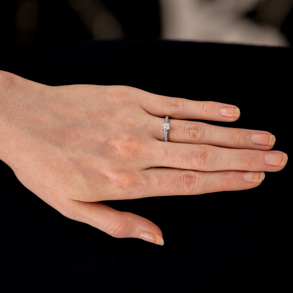 The Waterlily Platinum 0.70ct Cushion Cut Diamond Solitaire Engagement Ring With 0.21ct Diamond Set Shoulders