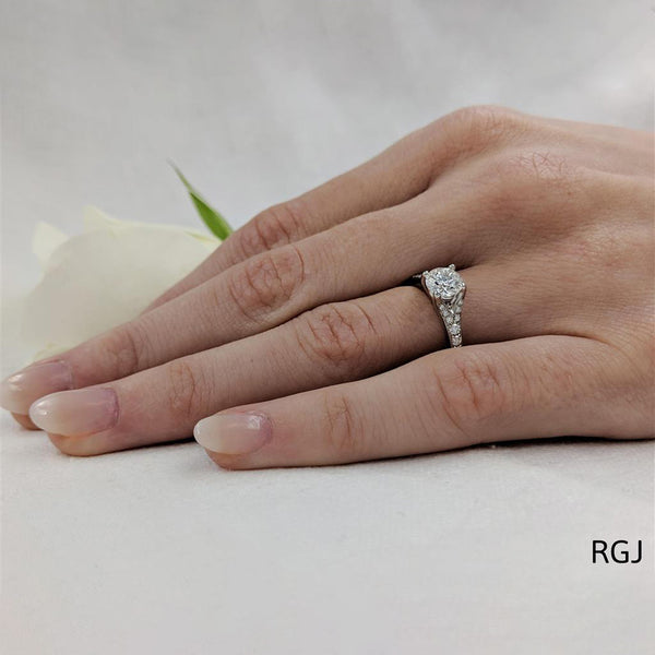 The Valentia Platinum 0.70ct Round Brilliant Cut Diamond Solitaire Engagement Ring With 0.24ct Diamond Set Shoulders