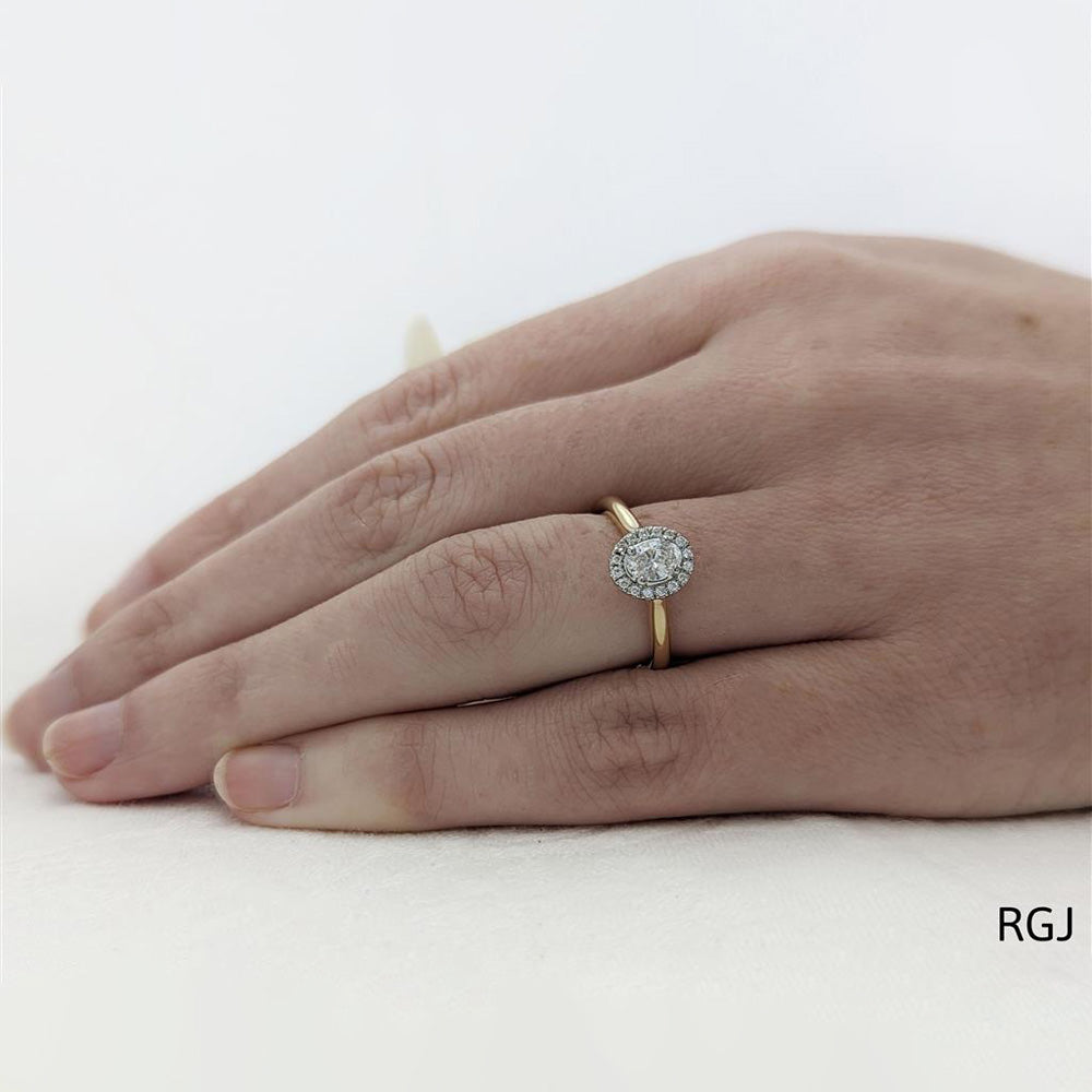 The Skye Pure 18ct Yellow Gold 0.30ct Oval Cut Diamond Engagement Ring With 0.15ct Diamond Halo