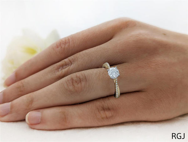 The Skye Twist 18ct Yellow Gold 0.70ct Round Brilliant Cut Diamond Engagement Ring With 0.14ct Diamond Twist Set Shoulders