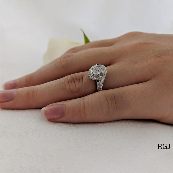 The Tiree Platinum 0.40ct Round Brilliant Cut Diamond Engagement Ring With 0.29ct Diamond Halo And Diamond Set Shoulders