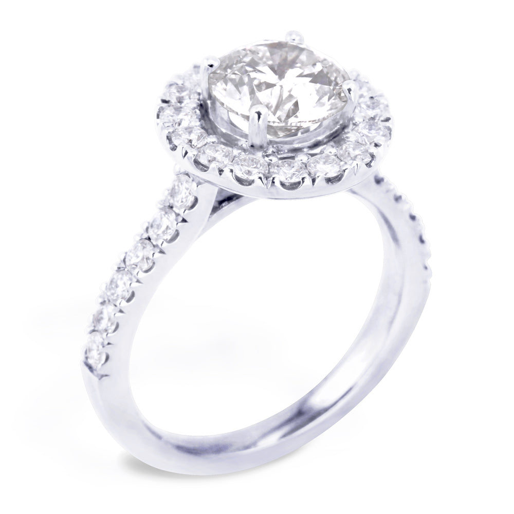 The Rosalia Platinum Round Brilliant Cut Diamond Engagement Ring With Diamond Halo And Diamond Set Shoulders