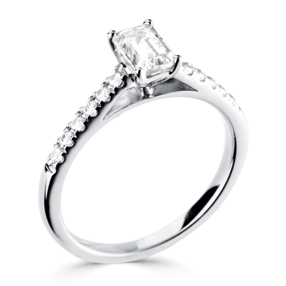 The Laurel Platinum 0.60ct Emerald Cut Diamond Solitaire Engagement Ring With 0.18ct Diamond Set Shoulders