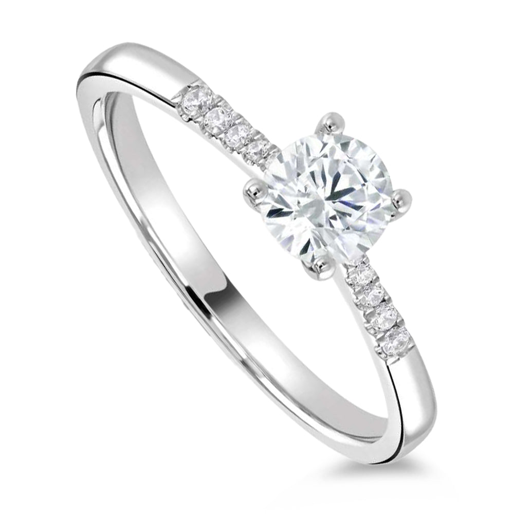 The Primula Platinum 0.30ct Round Brilliant Cut Diamond Solitaire Engagement Ring With 0.05ct Diamond Set Shoulders