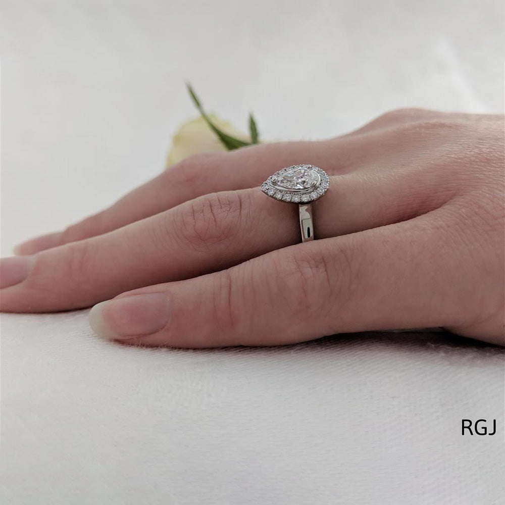 The Skye Pure Platinum 0.50ct Pear Cut Diamond Engagement Ring With 0.15ct Diamond Halo