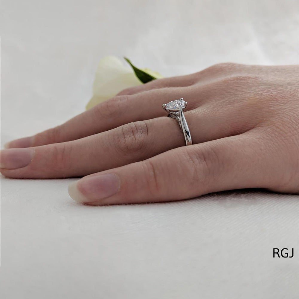The Oxford Platinum 0.50ct Pear Cut Diamond Solitaire Engagement Ring With 0.07ct Diamond Detailing