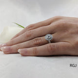 The Faroe Platinum 0.40ct Round Brilliant Cut Diamond Engagement Ring With 0.30ct Scalloped Diamond Halo And Diamond Set Shoulders