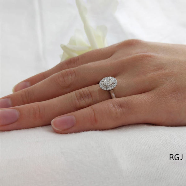 The Skye Pure Platinum 0.43ct Oval Cut Diamond Engagement Ring With 0.15ct Diamond Halo