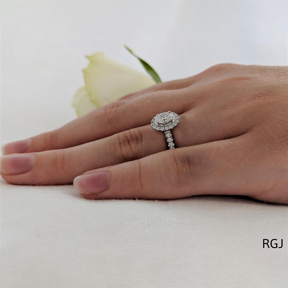 The Skye Platinum 0.40ct Oval Cut Diamond Engagement Ring With 0.31ct Diamond Halo And Diamond Set Shoulders