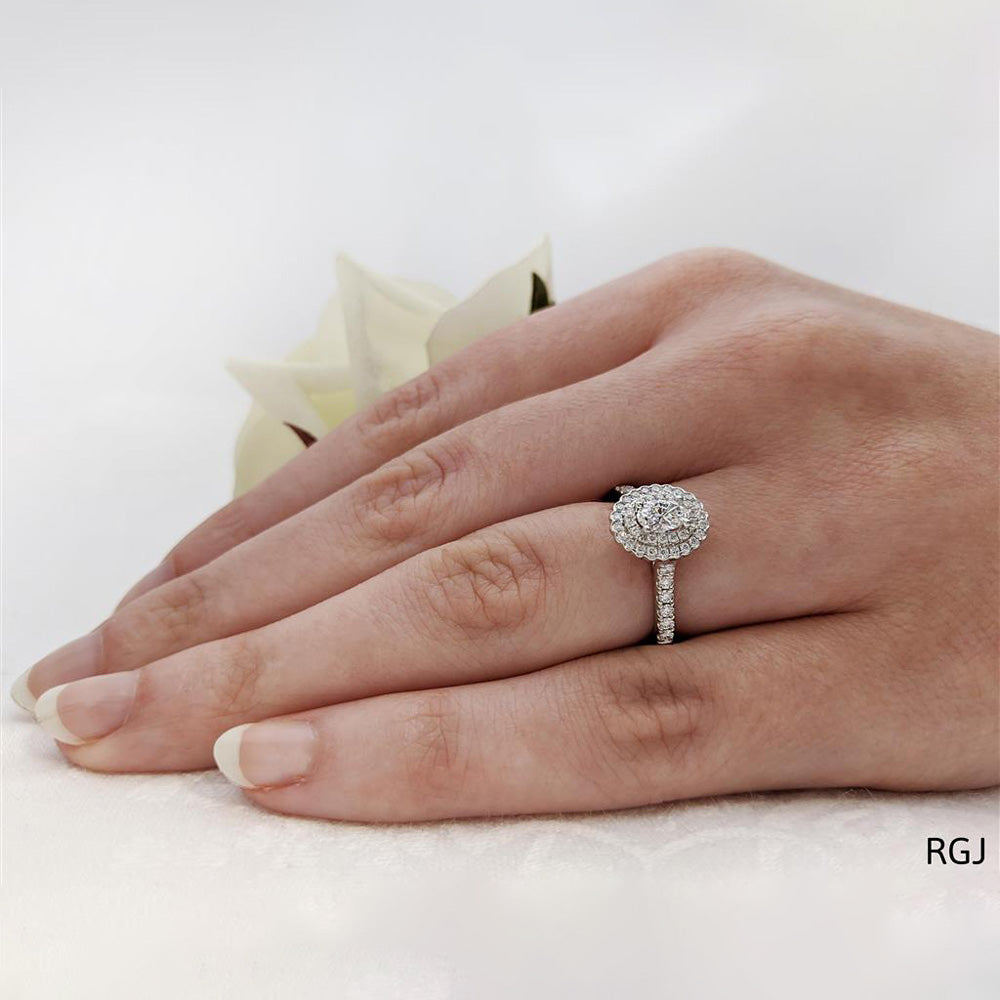 The Faroe Duo Platinum 0.34ct Oval Cut Diamond Engagement Ring With 0.38ct Scalloped Double Diamond Halo And Diamond Set Shoulders