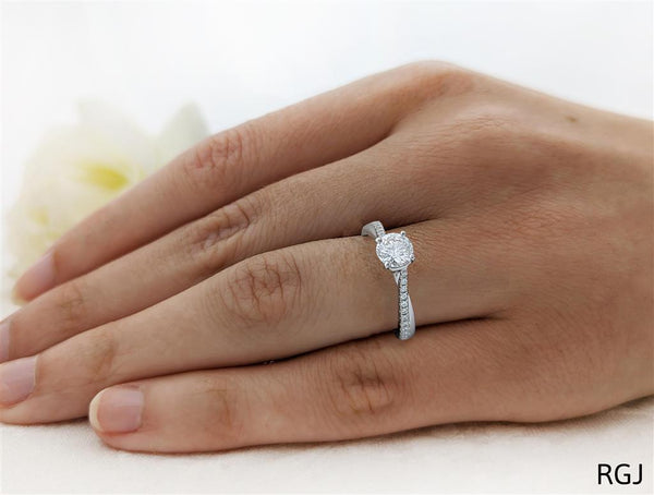 The Skye Twist Platinum 0.70ct Round Brilliant Cut Diamond Engagement Ring With 0.14ct Diamond Twist Set Shoulders