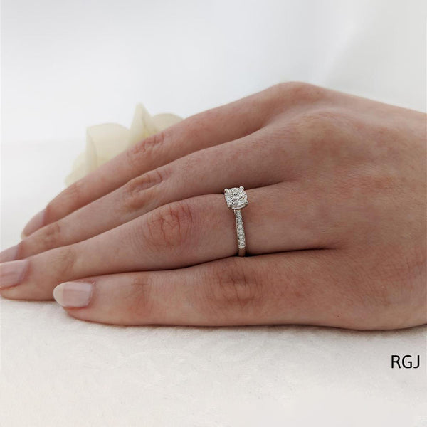 The Memoire Aura Platinum 0.50ct Round Brilliant Cut Diamond Solitaire Engagement Ring With 0.13ct Diamond Set Shoulders